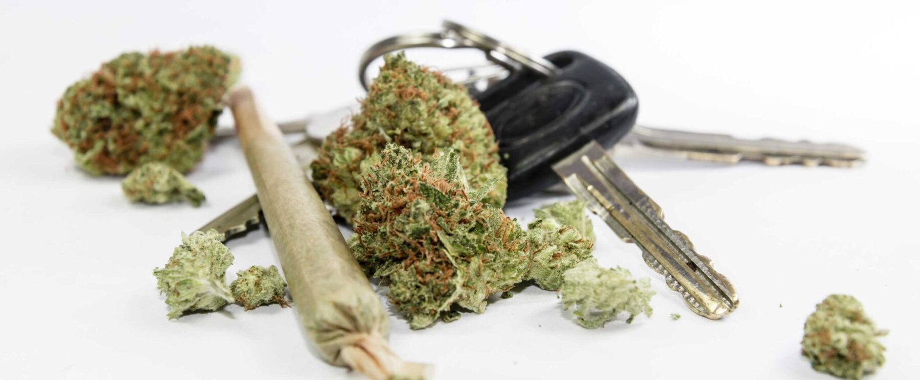 Marijuana blunt next to car keys on table