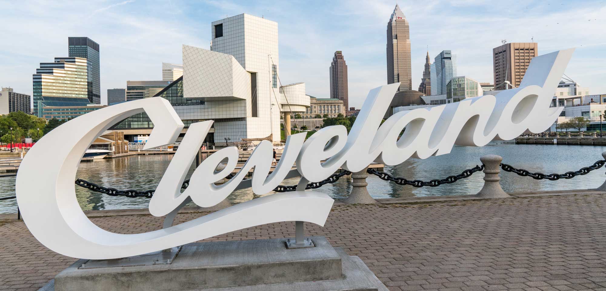 White Cleveland sign with Downtown skyline in the horizon